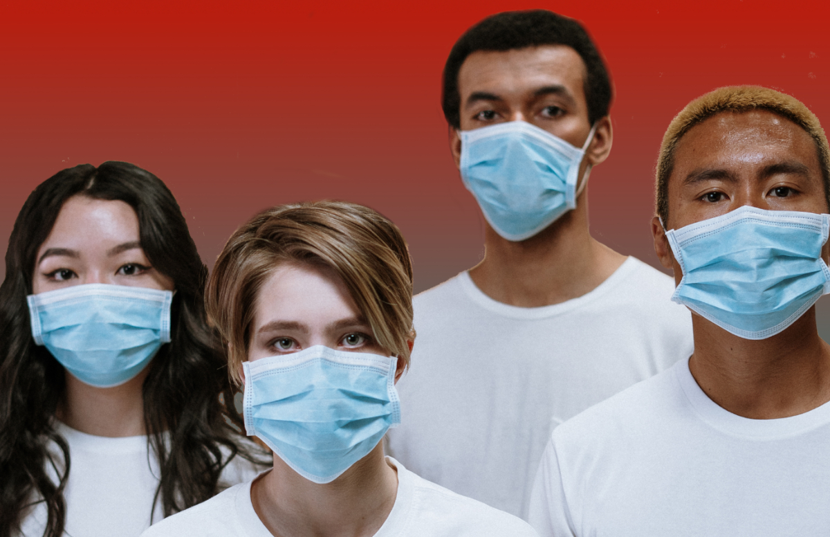 four people wearing surgical masks